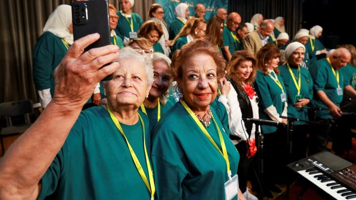 Members of the Golden Years Foundation perform artistic and musical acts on stage during a cultural event hosted by the nonprofit organization for elderly participants, aimed at empowering older adults and providing psychological and social support, in Cairo, Egypt, October 12, 2026. REUTERS/Mohamed Abdel Ghany