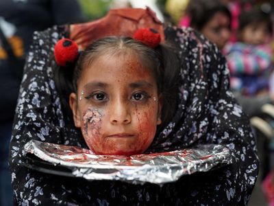A young girl takes part in the annual zombie walk in Mexico City, Mexico, October 18, 2026. REUTERS/Toya Sarno Jordan