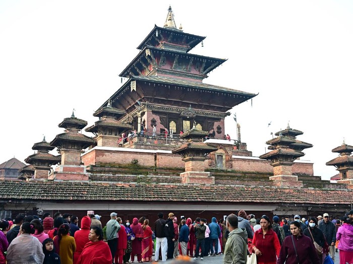 KATHMANDU, NEPAL - OCTOBER 20: Devotees queue to visit Taleju Bhawani Temple during Maha Nawami, the ninth day of the Dashain festival, at Hanuman Dhoka Durbar Square in Kathmandu, Nepal, on October 20, 2026. Located within the former royal palace complex, the historic temple opens to the public only once a year on Maha Nawami, attracting large numbers of worshippers seeking blessings from Goddess Taleju Bhawani. According to a 2025 report, around 500,000 devotees visited the temple on Maha Nawami in 2024. The temple is also associated with a jewel-studded necklace commissioned by King Pratap Malla, which disappeared in 1976 and later surfaced at the Art Institute of Chicago in the United States. The necklace was removed from public display in August 2025 amid efforts to secure its return to Nepal. Dashain, Nepalâs major Hindu festival, celebrates the victory of good over evil and honours Goddess Durga. Maha Nawami is marked by special prayers, worship and traditional animal sacrifice rituals at temples and shrines across the country. (Photo by Safal Prakash Shrestha/Anadolu via Getty Images)