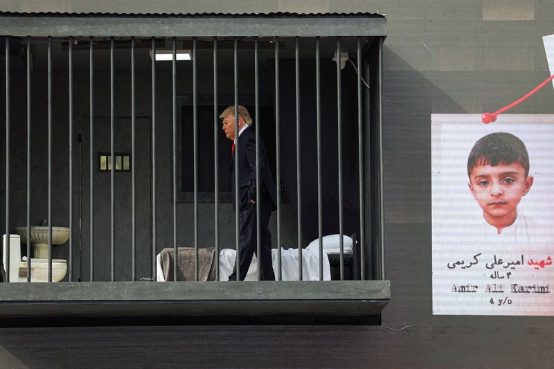 A person dressed up as US President Donald Trump inside a mock prison cell during a performance in Tehran, Iran, October 21, 2026. Majid Asgaripour/WANA (West Asia News Agency) via REUTERS ATTENTION EDITORS - THIS PICTURE WAS PROVIDED BY A THIRD PARTY. ISRAEL OUT. NO COMMERCIAL OR EDITORIAL SALES IN ISRAEL. NO ACCESS FOR ISRAELI MEDIA. NO USE BBC PERSIAN. NO USE VOA PERSIAN. NO USE MANOTO. NO USE IRAN INTERNATIONAL. NO USE RADIO FARDA. DIGITAL: NO USE BBC PERSIAN. NO USE VOA PERSIAN. NO USE MANOTO. NO USE IRAN INTERNATIONAL. NO USE RADIO FARDA.