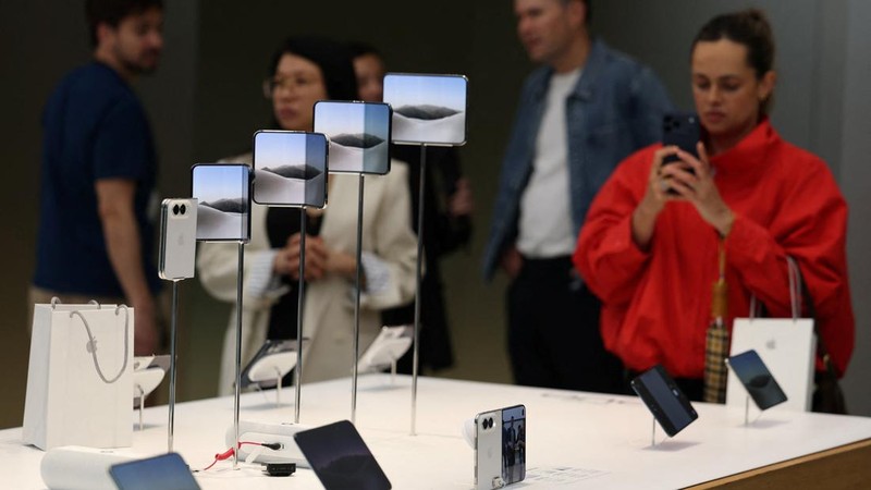 The new Apple iPhone Duo displayed during Apple's Sydney launch of its first folding phone, in Sydney, Australia, October 23, 2026. REUTERS/Hollie Adams