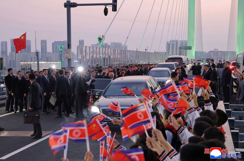 North Korean leader Kim Jong Un waves as he visits the New Yalu River Bridge linking Dandong, China, and Sinuiju, North Korea, during a trip to Dandong, Liaoning province, China, October 24, 2026, in this photo released by North Korea's Korean Central News Agency (KCNA). KCNA via REUTERS  ATTENTION EDITORS - THIS IMAGE WAS PROVIDED BY A THIRD PARTY. REUTERS IS UNABLE TO INDEPENDENTLY VERIFY THIS IMAGE. NO THIRD PARTY SALES. SOUTH KOREA OUT. NO COMMERCIAL OR EDITORIAL SALES IN SOUTH KOREA.