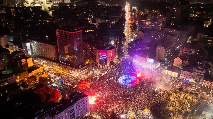 A drone view shows supporters of the electoral list Student List - Students Win gathering at Slavija Square to celebrate after Aleksandar Vucic, Serbian Progressive Party (SNS) prime ministerial candidate, conceded defeat in the parliamentary elect