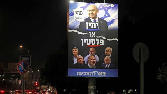 A man walks past an election billboard for the Likud party led by Israels Prime Minister Benjamin Netanyahu in Jerusalem on October 25, 2026, ahead of the legislative election. Israel heads to the polls on October 27 in its first election since the October 7, 2023 Hamas-led attack, in what is seen as a referendum on the prime minister. (Photo by AHMAD GHARABLI / AFP)