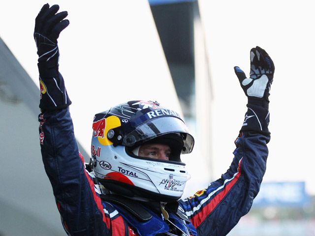 Vettel Pertahankan Gelar