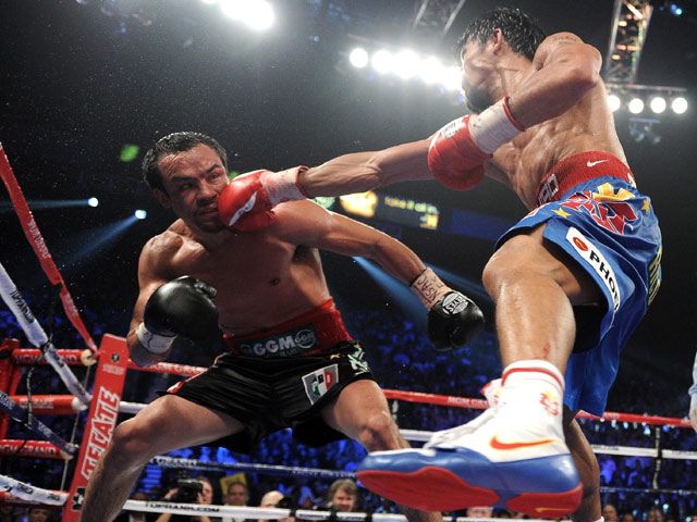 Kalahkan Marquez, Pacman Pertahankan Gelar