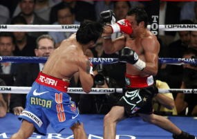 Menang Angka Atas Marquez, Pacman Pertahankan Gelar