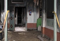 Masjid Rida terbakar akibat dibom molotov. Seorang imam masjid tewas saat mencoba memadamkan api. Reuters/Yves Herman.