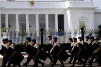 Polisi bersenjata pentungan dan tameng siap mengamankan aksi unjukrasa yang akan digelar, Selasa (27/3/2012) besok.
