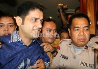 Saat keluar ruang sidang, Nazaruddin terus mengumbar senyum kepada wartawan. Ramses/detikcom.