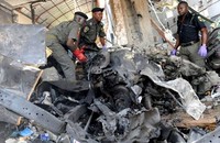 Polisi melakukan olah TKP di lokasi ledakan. Bom meledak dari sebuah mobil Jeep di area resepsionis kantor ThisDay. AFP/Pius Utomi Ekpei.