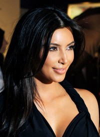 Sejak berpacaran dengan Kanye West, Kim pun nampak sangat bahagia. David Becker/Getty Images.