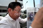 Menutup Wajah, Buron Korupsi Rp 5,6 M Ditangkap
