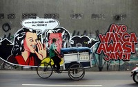 Jelang pencoblosan, lukisan dinding tersebut banyak tersebar di beberapa titik kawasan Ibu Kota.