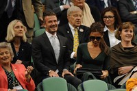 Pasangan tersebut terlihat duduk di tengah-tengah Royal Box. AFP PHOTO/Leon Neal.