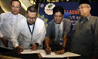 MOU eSmart Syariah dilakukan di jakarta disaksikan oleh Presiden Direktur BNISecurities Jimmy Nyo dan Ketua Dewan Syariah Nasional (DSN) Maruf Amin.
