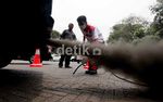 Knalpot Berasap Hitam Pekat Disisir