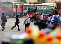 Para calon penumpang menunggu bus yang akan ditumpanginya di Terminal Blok M, Jakarta Selatan.