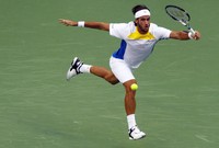 Bertanding di Qizhong Forest Sports City Arena, Kamis (11/10/2012), Lopez tak mampu membendung Djokovic dan kalah dua set langsung dengan skor 6-3, 6-3. REUTERS/Carlos Barria.