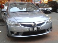 Mobil Honda Civic dengan pelat nomor yang agak vulgar. (Foto: Gunawan Saputra).
