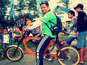 my father with wood bycycle