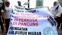 Aksi yang digelar dalam rangka Hari Buruh Migran Sedunia ini berlangsung di Bundaran HI, Jakarta.