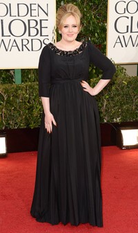 Ini merupakan penampilan perdana Adele pasca melahirkan anak pertamanya. Jason Merritt/Getty Images.