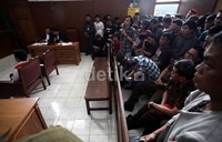 Suasana sidang Doyok yang dihadiri keluarga terdakwa dan keluarga korban.