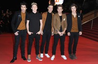 Harry tentunya hadir bersama personel One Direction lainnya. Pascal Le Segretain/Getty Images.