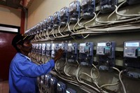 Seorang petugas mengecek alat meter listrik di Rusunawa Marunda.