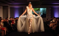 Desainer Adjie Notonegoro tampil mencuri perhatian dengan karyanya di akhir fashion show bertema Masterpiece Night itu. Dia merilis gaun pengantin transparan dengan bordir bunga.