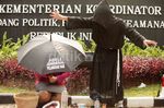Aksi Meruwat Kemenkopolhukam