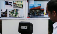 Maket konsep kampung deret, dalam gambar itu terlihat rumah berkonsep minimalis yang tertata rapi dengan pembangunan yang dipusatkan ke atas (vertikal). Gambar tersebut juga dilengkapi dengan ruang hijau yang asri.     