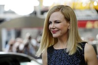 Nicole terseyum manis di depan kamera. AFP/Anne Christine Poujoulat.