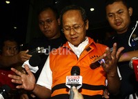 Deddy Kusdinar hanya tersenyum saat keluar gedung KPK. Lamhot Aritonang/detikFoto.