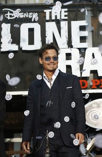 Wajah sumringah Johnny Depp. REUTERS/Mario Anzuoni.