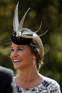 Senyum manis nan mempesona dari Pippa Middleton. REUTERS/Phil Noble.