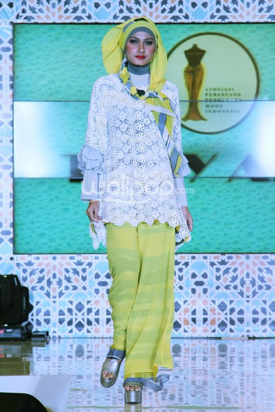 Jakarta - Indonesia. Tuty Adib Ramadhan Runway 2014 at Grand Atrium Kota Kasablanka. 27 Juli 2013. Jakarta. [Foto: Mohammad Abduh/Wolipop]