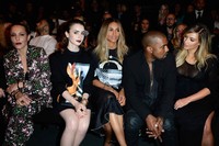 Lily Collins duduk di jajaran depan bersama Kim Kardashian, Kanye West, dan Ciara. Pascal Le Segretain/Getty Images.     