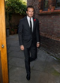 Setelan necis ala David Beckham. Ian Gavan/Getty Images.     