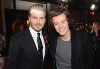 Di acara tersebut, David Beckham juga sempat berfoto bersama Harry Styles dari One Direction. Dave J Hogan/Getty Images.     