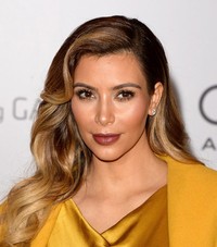 Kekasih Kanye West itu terlihat berseri-seri. Jason Merritt/Getty Images/AFP.