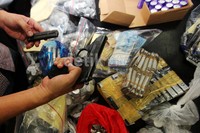 Barang bukti yang diamankan di antaranya dua pucuk senjata api, uang tunai hingga mobil.