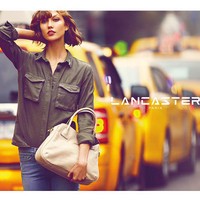 Si model jenjang Karlie Kloss terpilih menjadi wajah rumah mode Paris, Lancaster. Difoto oleh Guy Aroch, rumah mode ini jelas sekali ingin meraih target pasar yang lebih muda dan dinamis dengan visual hingar-bingar ala kota New york. Serupa seperti pengulangan iklan DKNY dengan latar kota besar dan mobil-mobil yang berseliweran di latar.