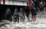 Jalan Yos Sudarso Terendam Banjir