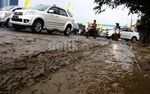 Banjir Sisakan Kerusakan Jalan