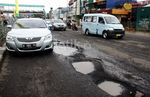 Banjir Sisakan Kerusakan Jalan