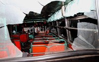 Metro Mini milik dirusak massa yang kesal. Seluruh kaca mobil pecah.