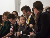 Harper yang duduk di pangkuan sang ayah nampak sangat menggemaskan. REUTERS/Eric Thayer.