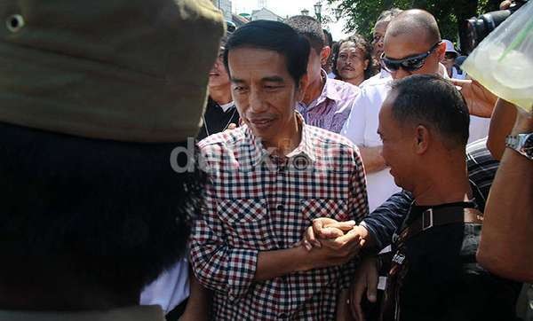 Jokowi dan Keyakinannya pada PSSI